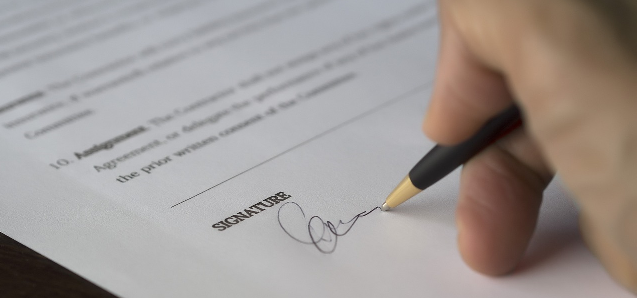 Person signing a contract